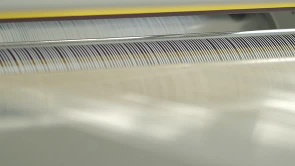 Closeup of Polymer Thread Making Machine in Action alt