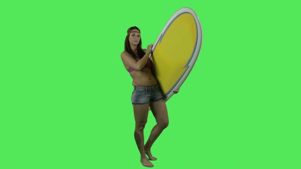 Female surfer with surfboard