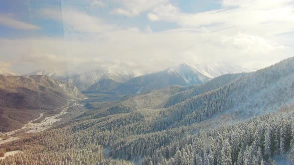 Aerial View Snow Covered Mountains and Ski Resort alt