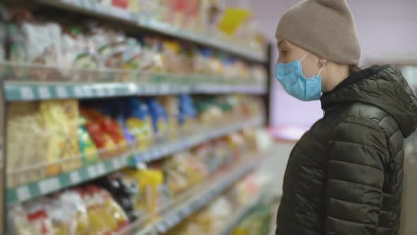 Woman Wearing Medical Mask in Supermarket alt