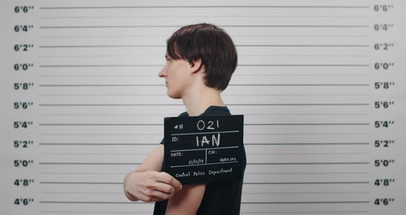 Profile Mugshot of Male Person with Dark Hair Turning to Different Sides and Looking to Camera alt