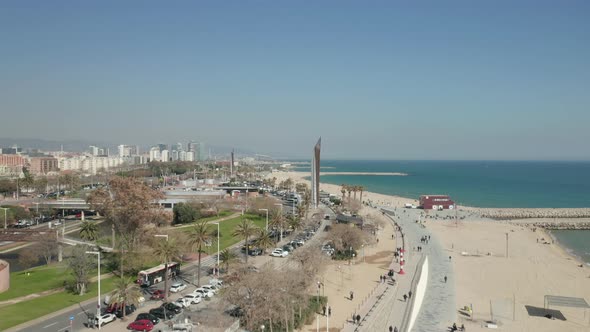Drone Flight Over Barcelona Beach on Beautiful Sunny Day with Blue Sky  alt