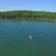 People Canoeing On Lake With Island Aerial - VideoHive Item for Sale