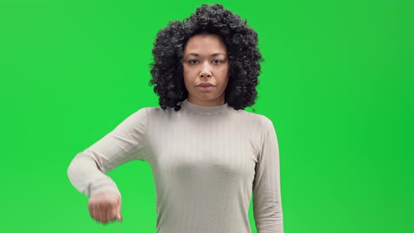Green Screen Young African Female Shows Sing Thumb Down