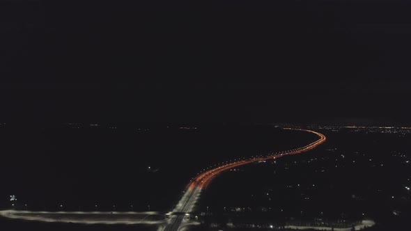 Aerial view of Night highway with orange and white lanterns and lightning 06 alt