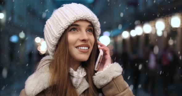 Girl Talking on Phone at Night