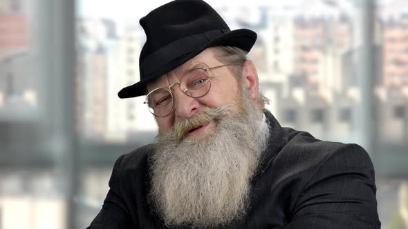 Old Senior Businessman Giving a Piece of Advice alt