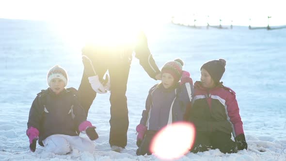 Happy Children and Their Mother Playing With Snow on Sunny Day, Slow Motion