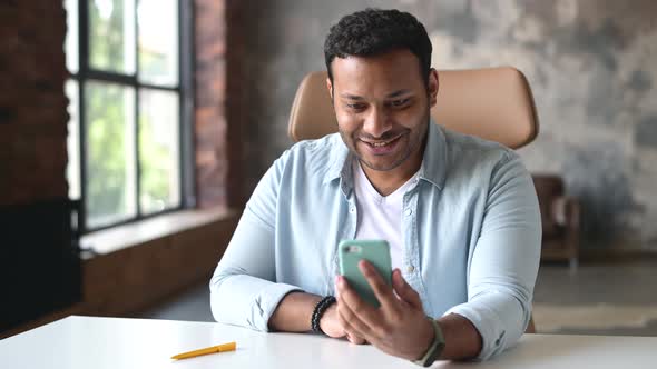 Joyful Indian Man Talking By Video Call on the Smartphone alt