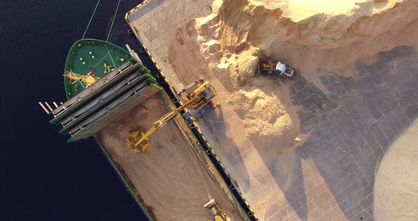 4K - Dry-cargo vessel. Ship loading. Top view alt