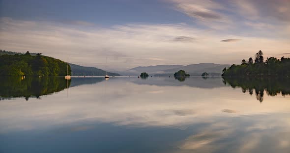 Lake District sunrise landscape time lapse at Lake Windermere. 4k timelapse of perfect reflection of alt