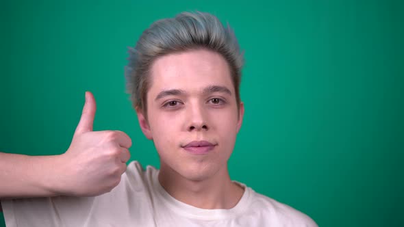 Young Smiling Man Showing Like on Camera Positive Emotions Portrair Blue Hair