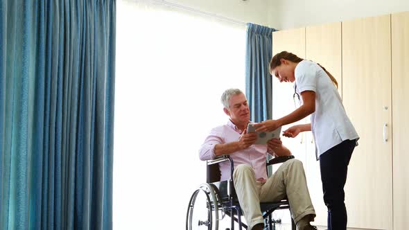 Nurse giving tablet to his patient alt