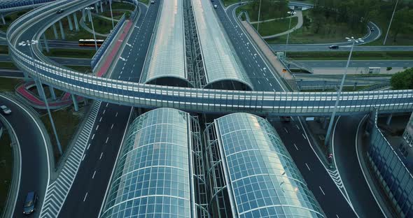 Highway glass tunnel and multi-lanes highway seen from drone point of view. alt