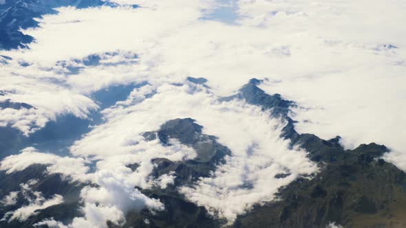 Flying Above the Clouds and the Mountains alt