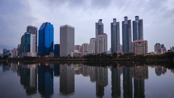 day to night Time-lapse of Bangkok city view at Benjakitti Park, Bangkok, Thailand. alt
