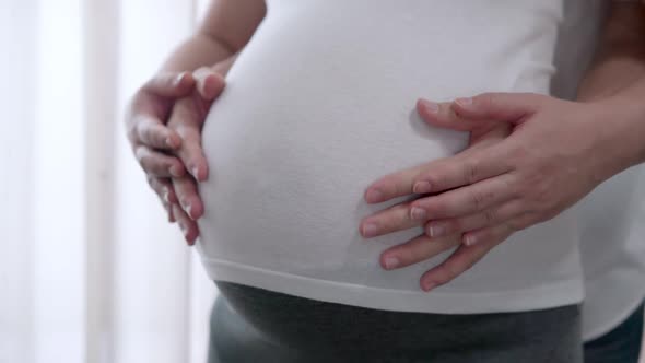 Pregnant Couple Feels Love and Relax at Home alt