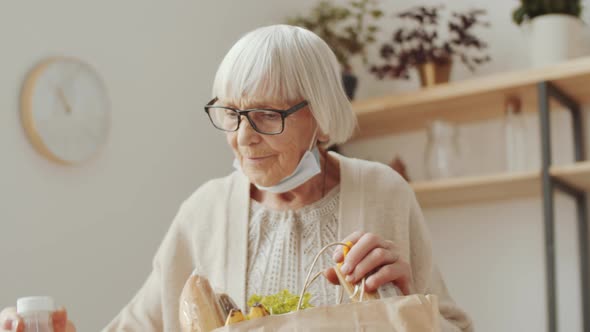 Old Woman Unloading Grocery Bag at Home, Stock Footage | VideoHive