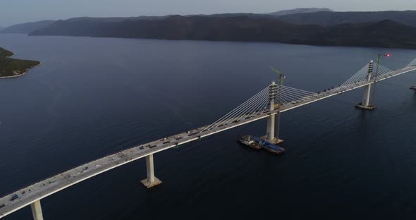 Aerial view of Peljeski bridge crossing the Bay of Mali Ston in Croatia. alt
