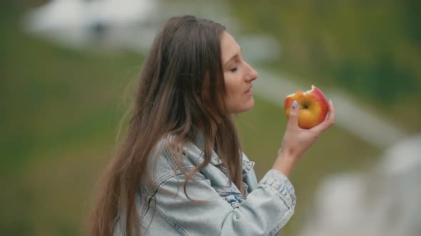 Girl Eating an Apple alt