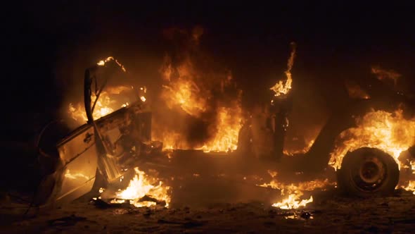 Broken car burns after an accident