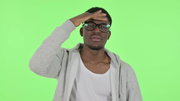 African Man Looking Around Searching Green Screen alt