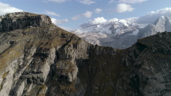 Aerial Slowmotion towards Mountain with the Italian Dolomites in the Background alt
