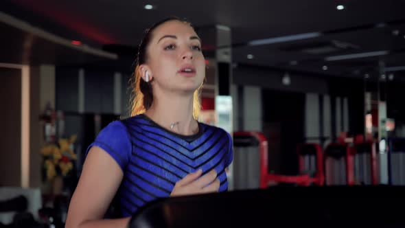 Russian woman running on a treadmill