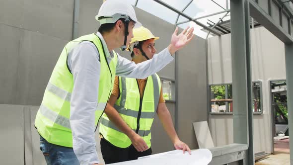 Asian construction workers people wear protective safety helmet and working onsite of architecture. alt