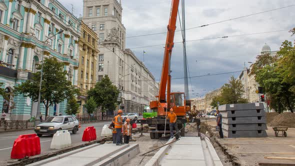 Installing Concrete Plates By Crane at Road Construction Site Timelapse. alt