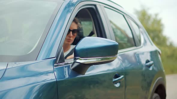 Automobile Transportation Concept Independent Woman. Woman Driver Hand Prepare Driving SUV. alt