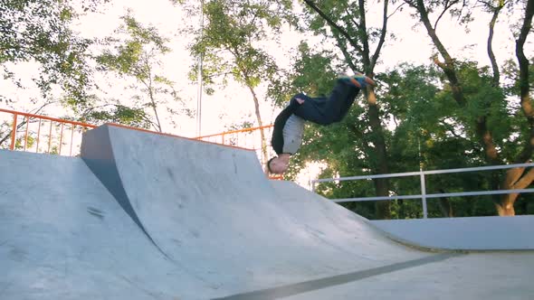Young Man Doing Parkour Tricks in Extreme Sports Park alt