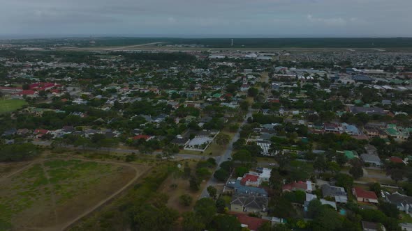 Fly Above Family Houses in Urban Borough on Town Outskirts alt