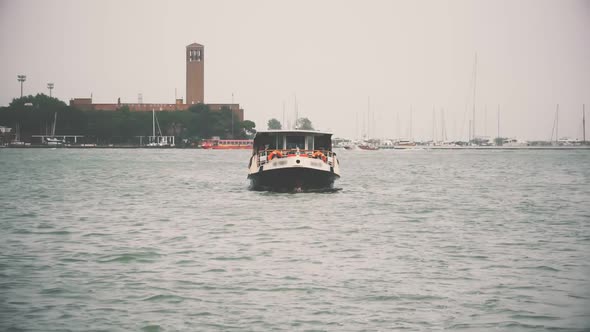 COVID-19. Boat Vaporetto on Canal, Venice, Italy alt