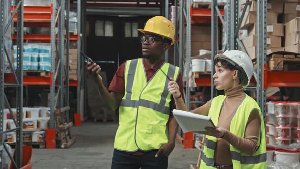Female and Male Warehouse Workers in Workplace alt