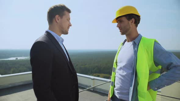 Young Businessman and Construction Manager Shaking Hand, Work Agreement, Service