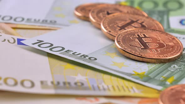 Bitcoin Coins Fall on Euro Banknotes