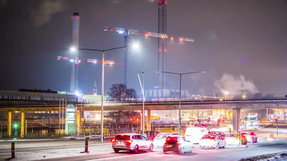 Time Lapse of City Road and Smokestacks at Night