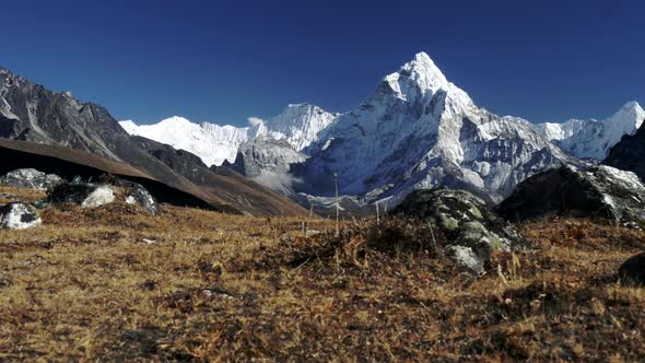 High Rocky Snowy Mountains Against a Clear Sky. Gimbal Stabilized Shot. Mt Ama Dablam, Sagarmatha alt