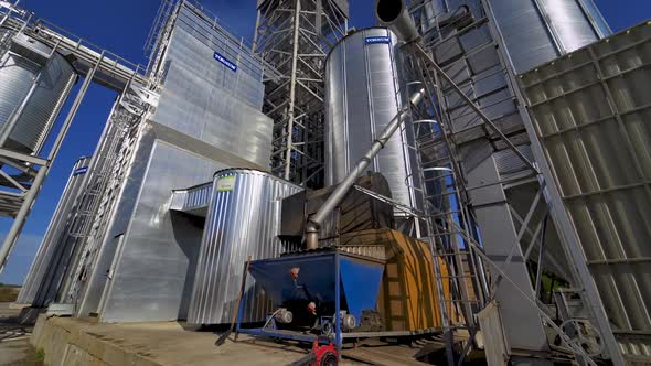 Exterior of industrial plant. Modern construction of grain elevators outdoors.  alt