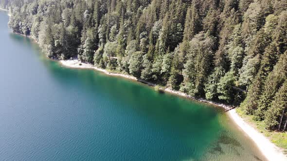 beautiful drone video of an lake and mountains, eibsee in bavaria alt