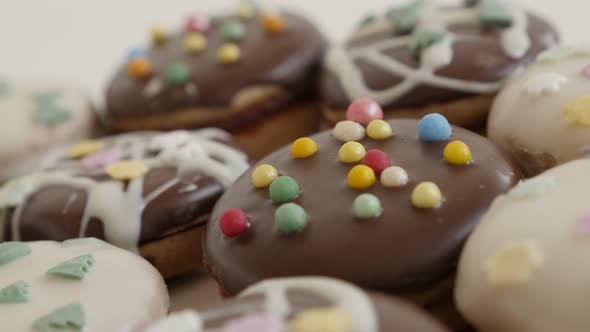 Assorted cookies with sprinkles shallow DOF 4K 2160p 30fps UltraHD footage - Colorful teacakes stuff alt