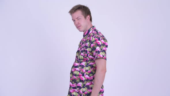 Profile View of Young Fat Tourist Man with Big Belly Posing alt
