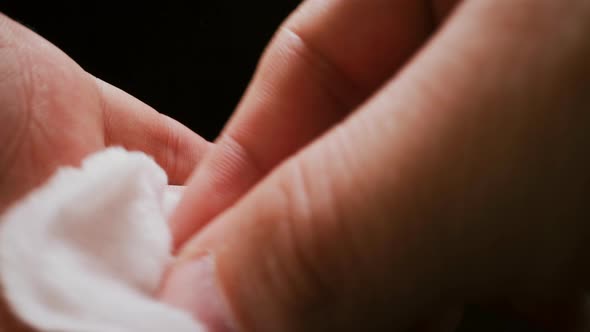 Person Wipes Palm and Fingers with Cotton Antiseptic Patch alt