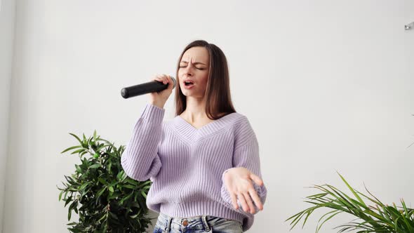 Young Woman Sing at Home