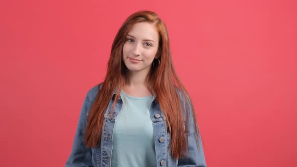 Happy Woman Make with Fingers Heart Shape Isolated Over Red Background alt