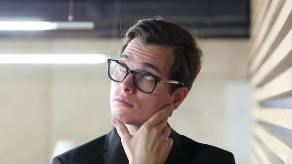 Pensive Businessman Thinking About his Problems alt