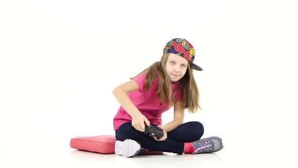 Teenager with Games Console Playing Video Game on White Background alt