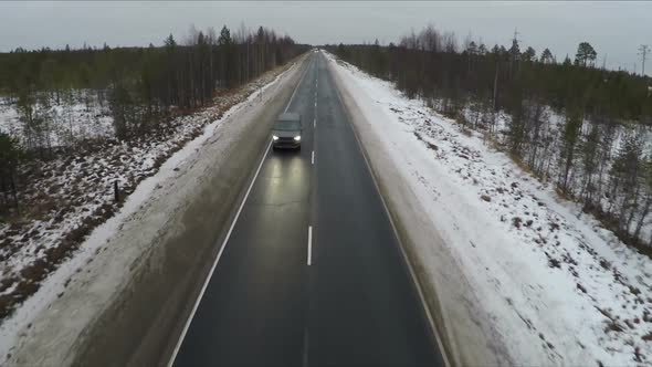 Driving Along A Winter Road alt
