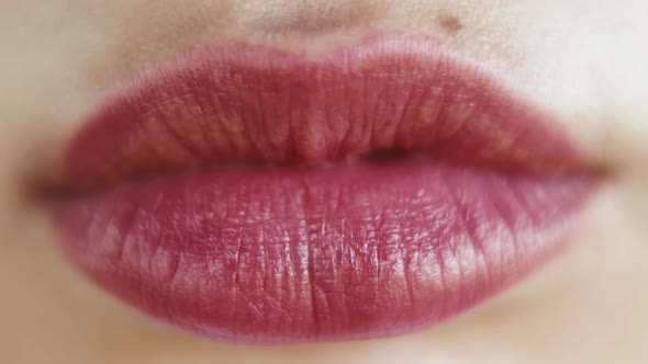 Close Up Red Lips. Close Up of a Womans Face with Bright Red Lipstick on Her Lips alt